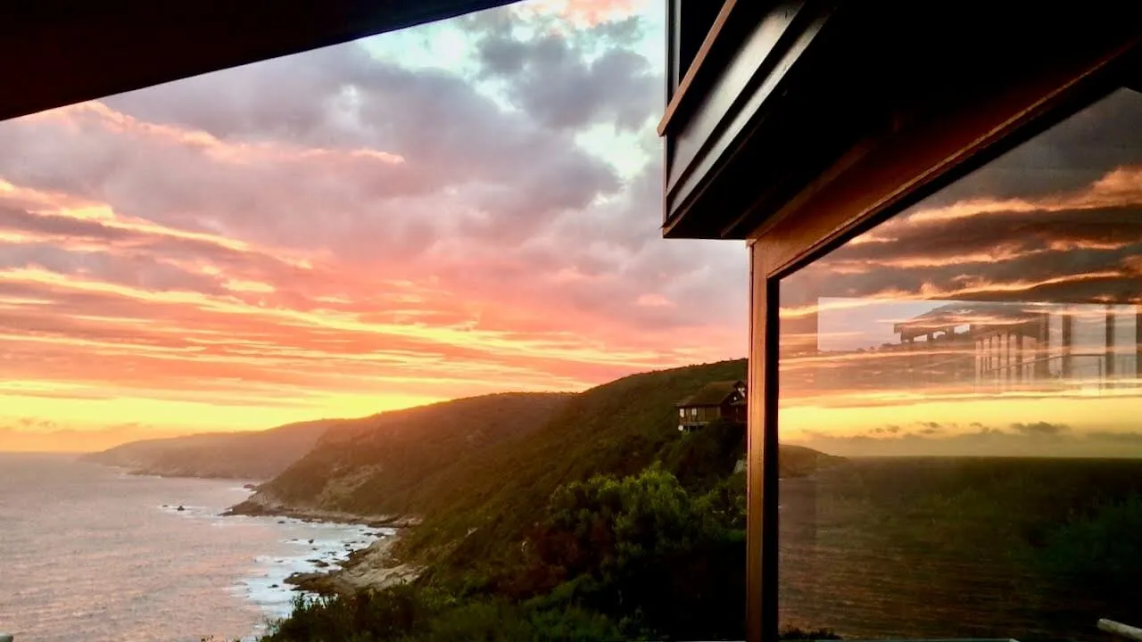 Sunset over the Indian Ocean seen from The Bee's Knees cliff-top holiday house on the Garden Route